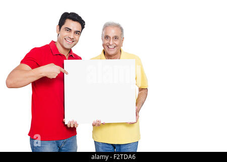 2 indian Adult Father and son Showing Message Board Stock Photo