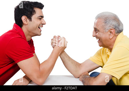 2 indian Father and son Arm Wrestling Stock Photo