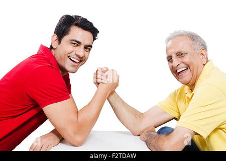 2 indian Father and son Arm Wrestling Stock Photo