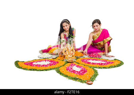 2  indian mother and daughter Diwali Festival Rangoli Stock Photo
