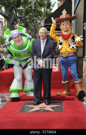 LOS ANGELES, CA - JUNE 2, 2010: Composer Randy Newman with Toy Story 3 stars Buzz Lightyear and Woody was honored today with a star on the Hollywood Walk of Fame. Stock Photo