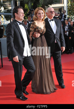 CANNES, FRANCE - MAY 22, 2010: Director Nikita Mikhalkov (glasses), actress Nadezhda Mihalkova & actor Artem Menshikov at the premiere of their movie 'Exodus - Burnt by the Sun' at the 63rd Festival de Cannes. Stock Photo