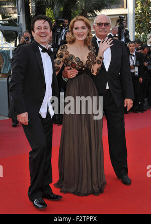 CANNES, FRANCE - MAY 22, 2010: Director Nikita Mikhalkov (glasses), actress Nadezhda Mihalkova & actor Artem Menshikov at the premiere of their movie 'Exodus - Burnt by the Sun' at the 63rd Festival de Cannes. Stock Photo