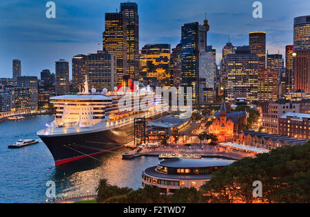 huge transatlantic cruise ship docked new overseas passenger terminal in Sydney Harbour at Sunrise Stock Photo