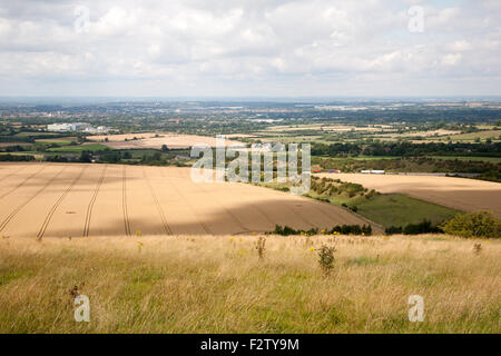 Summer landscape of golden rolling arable fields view north from near Liddington castle, Wiltshire, England UK M4 Swindon Stock Photo