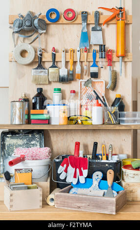 Workshop tool board with various hand tools for painting and crafting. Stock Photo