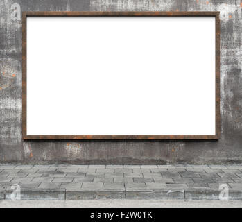 Blank advertising billboard with rusty frame on a dirty grunge wall. Stock Photo