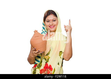 1 indian Adult woman Villager Piggy Bank Saving money finger pointing Stock Photo