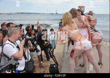 CANNES, FRANCE - MAY 13, 2010: Zombie Women of Satan photocall on the beach at the 63rd Festival de Cannes. Stock Photo