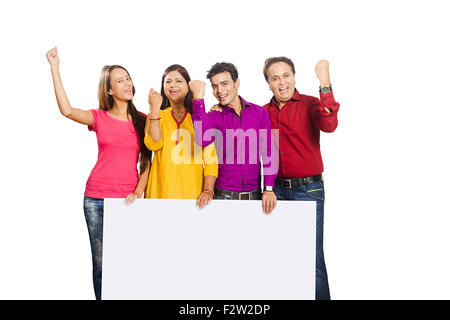 4 indian family Parents young daughter and son Message Board showing Stock Photo