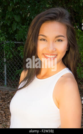 Vietnamese American young woman age 30's portrait outdoors smiling MR-8 Model Released Stock Photo