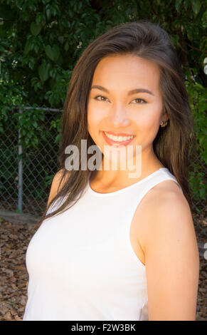 Vietnamese American young woman age 30's portrait outdoors smiling MR-8 Model Released Stock Photo