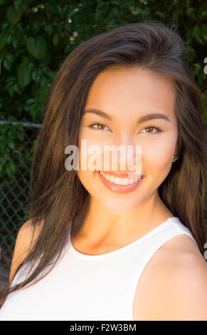 Vietnamese American young woman age 30's portrait outdoors smiling MR-8 Model Released Stock Photo