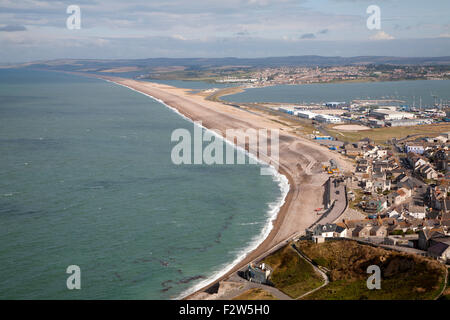 Chesil beach tombolo with housing in Chiswell in the foreground, Isle of Portland, Dorset, England, UK Stock Photo