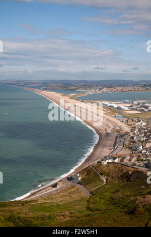 Chesil beach tombolo with housing in Chiswell in the foreground, Isle of Portland, Dorset, England, UK Stock Photo