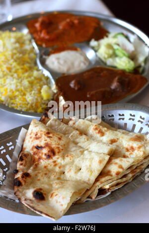 Close up of freshly made Naan bread in a bowl Stock Photo