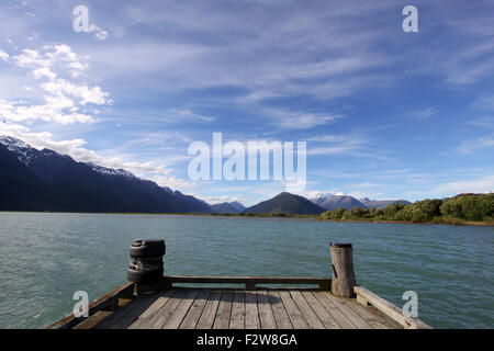 View of Lake Wakatipu from a wooden dock in Glenorchy, New Zealand