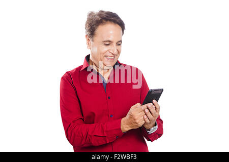 1 indian Adult Man dialing Mobile Phone Stock Photo