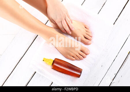 Women's feet. Luxury spa stupas. Beautiful female feet, smooth and neat.  Beautiful feet of a woman during treatments Stock Photo - Alamy