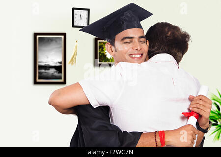 2 indian father and young son Student Hugging Celebration Lawyer Degree Stock Photo