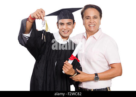 2 indian father and young son Student Lawyer showing key new car gift Stock Photo
