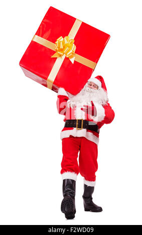 walking Santa Claus carries Christmas gift isolated on white background Stock Photo