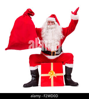 Santa Claus shows Christmas gift isolated on white background Stock Photo