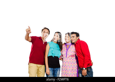 4 indian family Parents young daughter and son finger pointing showing Stock Photo