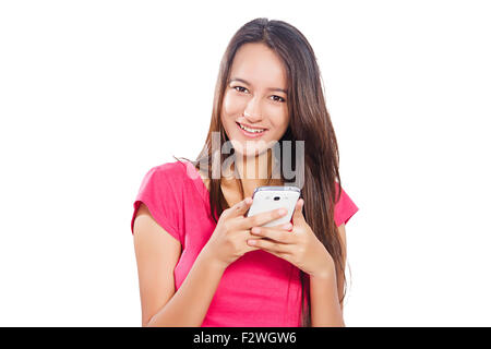 1 indian Young Woman dialing Mobile Phone Stock Photo