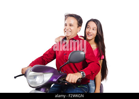 2 indian father and young daughter Scooty Riding enjoy Stock Photo