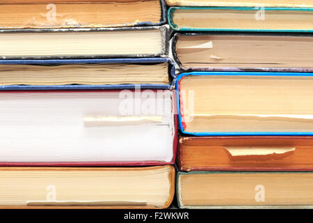 A stack of old books with bookmarks in different directions on different pages. Stock Photo