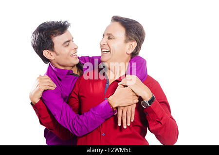 2 indian father and young son standing enjoy Stock Photo