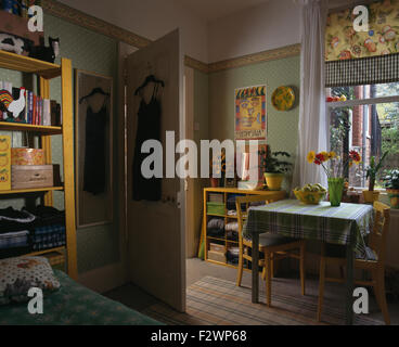 Checked cloth on table in green economy style nineties dining room Stock Photo