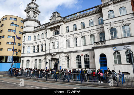 International students queue to register with OVRO - Overseas Visitors Records Office Stock Photo