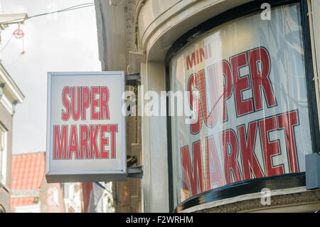 Sign outside a Mini Market supermarket, souvenir shop and drug store ...
