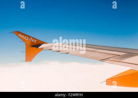 Wing of an easyJet plane in flight. Stock Photo