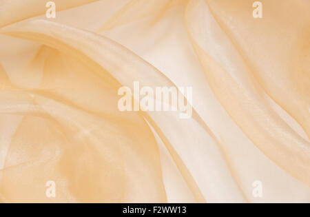 Pale pink organza fabric with folds. texture background Stock Photo