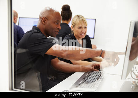Engineers Using CAD System In Design Studio Stock Photo