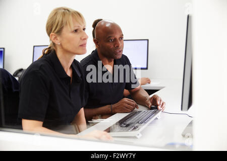 Engineers Using CAD System In Design Studio Stock Photo