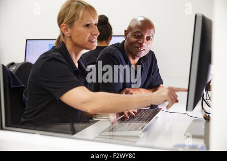Engineers Using CAD System In Design Studio Stock Photo