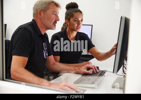 Engineers Using CAD System In Design Studio Stock Photo