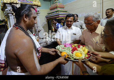 A Hindu priest performing a puja ceremony inside the Sri Veeramakaliamman Temple in Little India, Singapore. Stock Photo