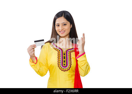 1 indian Woman Housewife Credit Card showing finger pointing Stock Photo