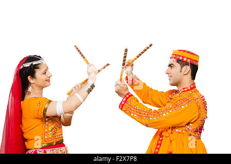 2 indian Gujrati Married Couples Navaratri Dandiya dance Stock Photo