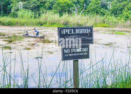 Crocodile warning sign near an artificial pond in Tikal Guatemala's national park Stock Photo