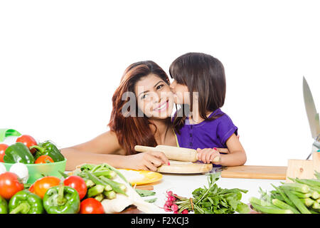 2 indian Mother and kid daughter Kitchen Cooking Stock Photo
