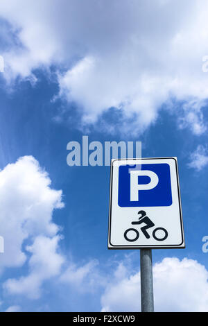 Road sign of parking motorcycle with blue sky in the background Stock Photo