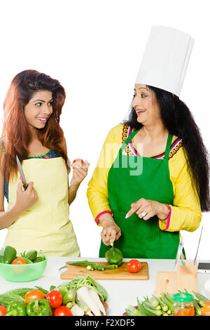 2 indian Adult Woman mother and daughter Kitchen Cooking Stock Photo