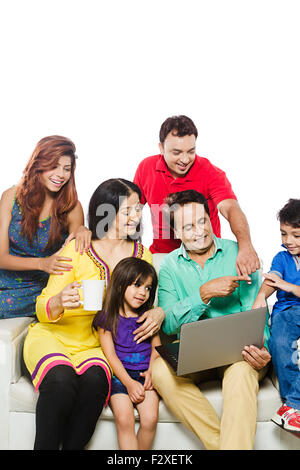 indian Group Joint Family Laptop working finger pointing gesturing Stock Photo