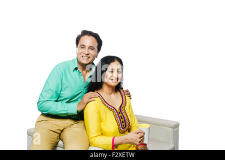 2 indian adult Married Couple sitting home laptop working Stock Photo